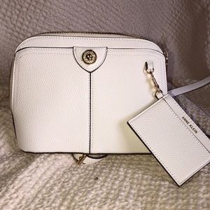 Anne Klein Crossbody White bag. Holders in bag for credit cards and 3 zippers